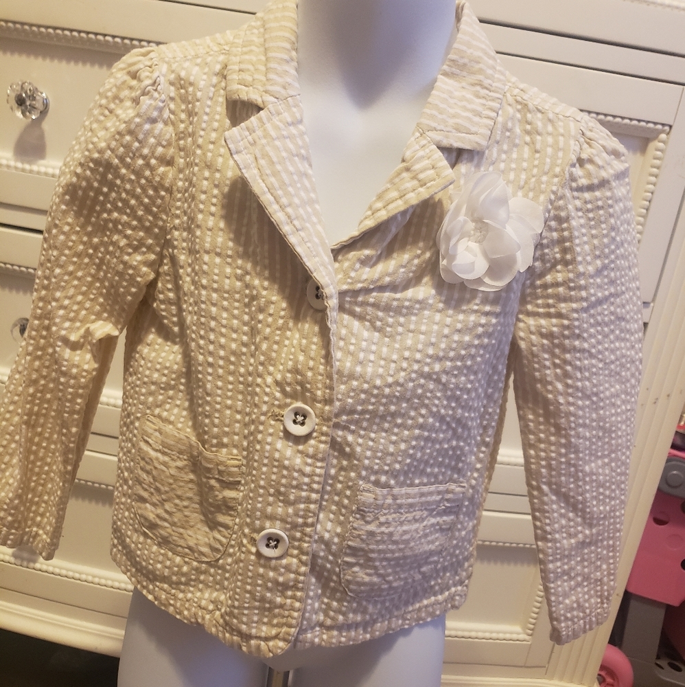 Adorable Toddler Blazer. Flower detail, buttons, and front pockets.